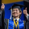 Graduate giving thumbs up